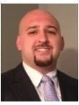 John E Tsikerdanos
