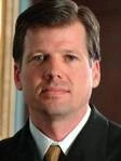 James E. Girards
