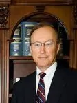 John E. Suthers
