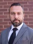 Eric M Helman
